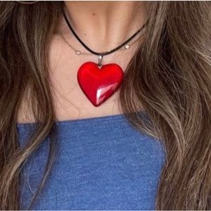 Large red heart glass necklace.